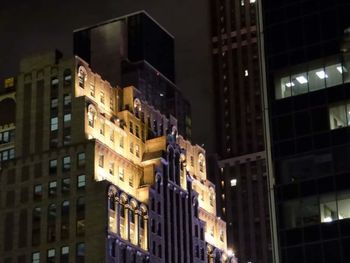 Buildings in city at night