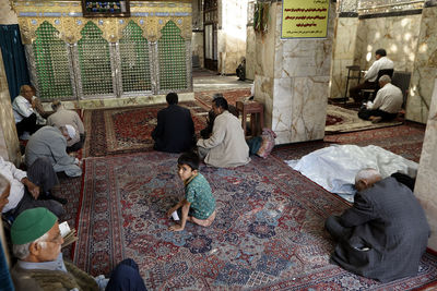 High angle view of people sitting outside building