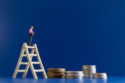 Low angle view of man against blue sky