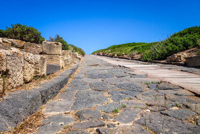 View of old ruins against blue sky