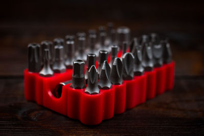 Close-up of drill bits arranged on table