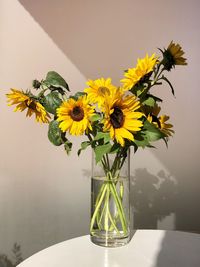 Close-up of yellow flower in vase on table