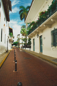 Street amidst buildings against sky