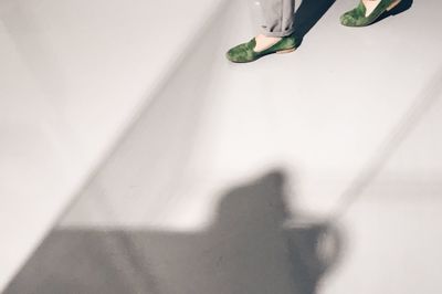 Low section of woman standing on floor