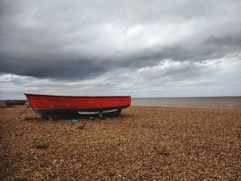 Lifeguard hut on beach against sky