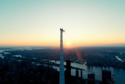 High angle view of cityscape against clear sky during sunset