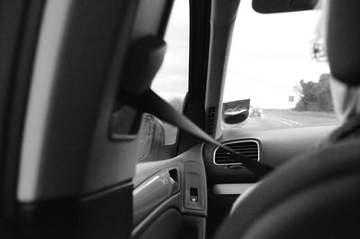 Cropped image of woman driving car