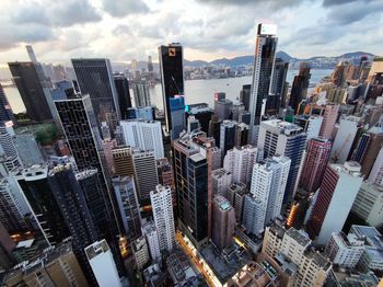 Aerial view of modern buildings in city against sky