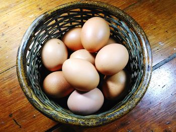 High angle view of eggs in basket on table