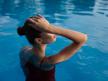 High angle view of woman swimming in pool