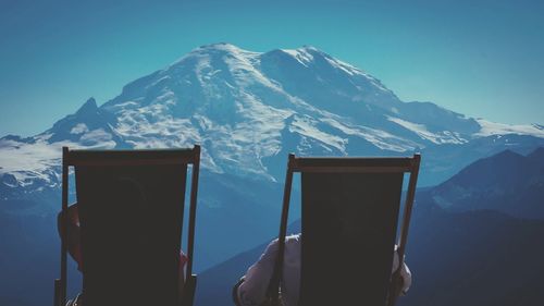 Scenic view of snow covered mountains against sky