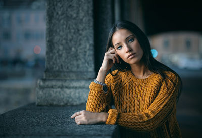 Portrait of young woman standing