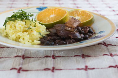 Close-up of fruits in plate on table