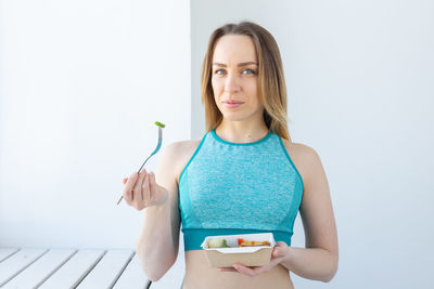 Portrait of woman eating food