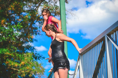 Low angle view of woman against sky