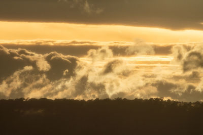 Low angle view of dramatic sky during sunset