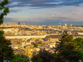 Cityscape of paris with cloudy sky from montmartre, paris, france