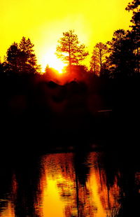 Scenic view of sunset over river