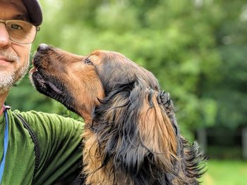 Portrait of man with dog outdoors