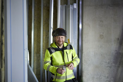 Smiling worker looking at camera