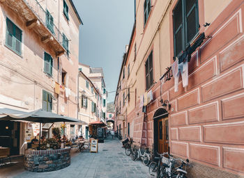 People on street amidst buildings in city