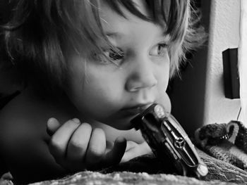 Close-up of boy with toy car