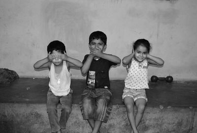 Portrait of children covering eyes ear and mouth