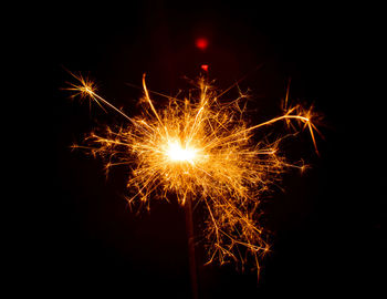 Close-up of firework display against sky at night