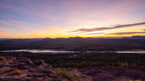 Scenic view of landscape against sky during sunset