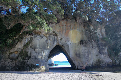 Scenic view of sea seen through cave