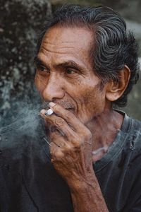 Close-up of man smoking