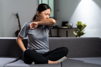 Young woman exercising in gym