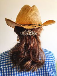 Rear view of woman wearing hat