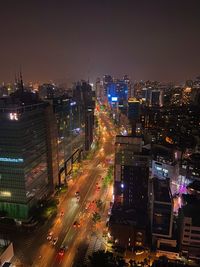 High angle view of illuminated city buildings at night