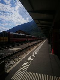 Train on railroad station platform against sky