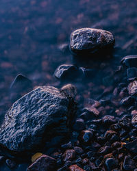 Close-up of stones in sea