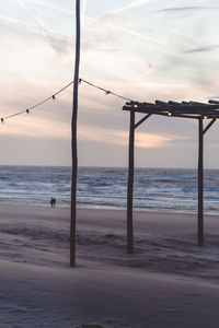 Scenic view of beach against sky during sunset