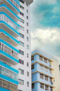 Low angle view of apartment building against sky