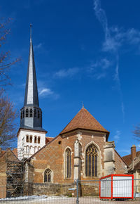 Low angle view of building against blue sky