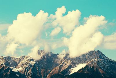 Panoramic view of snowcapped mountains against sky