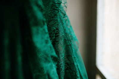 Close-up of green dress at home