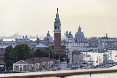 View of buildings in city against sky