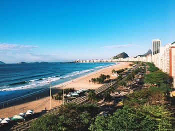 Scenic view of beach against blue sky