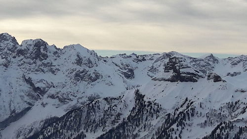 Scenic view of snowcapped mountains against sky