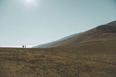 Man on mountain against sky