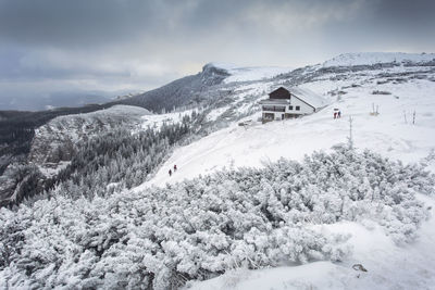 Scenic view of snowcapped landscape against sky