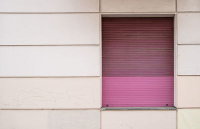 Closed shutter of window in building exterior