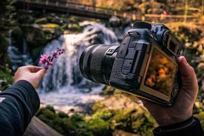 Midsection of person photographing