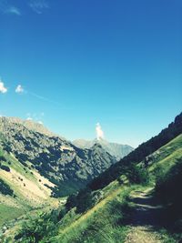 Scenic view of landscape against blue sky