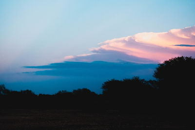 Scenic view of silhouette landscape against sky during sunset